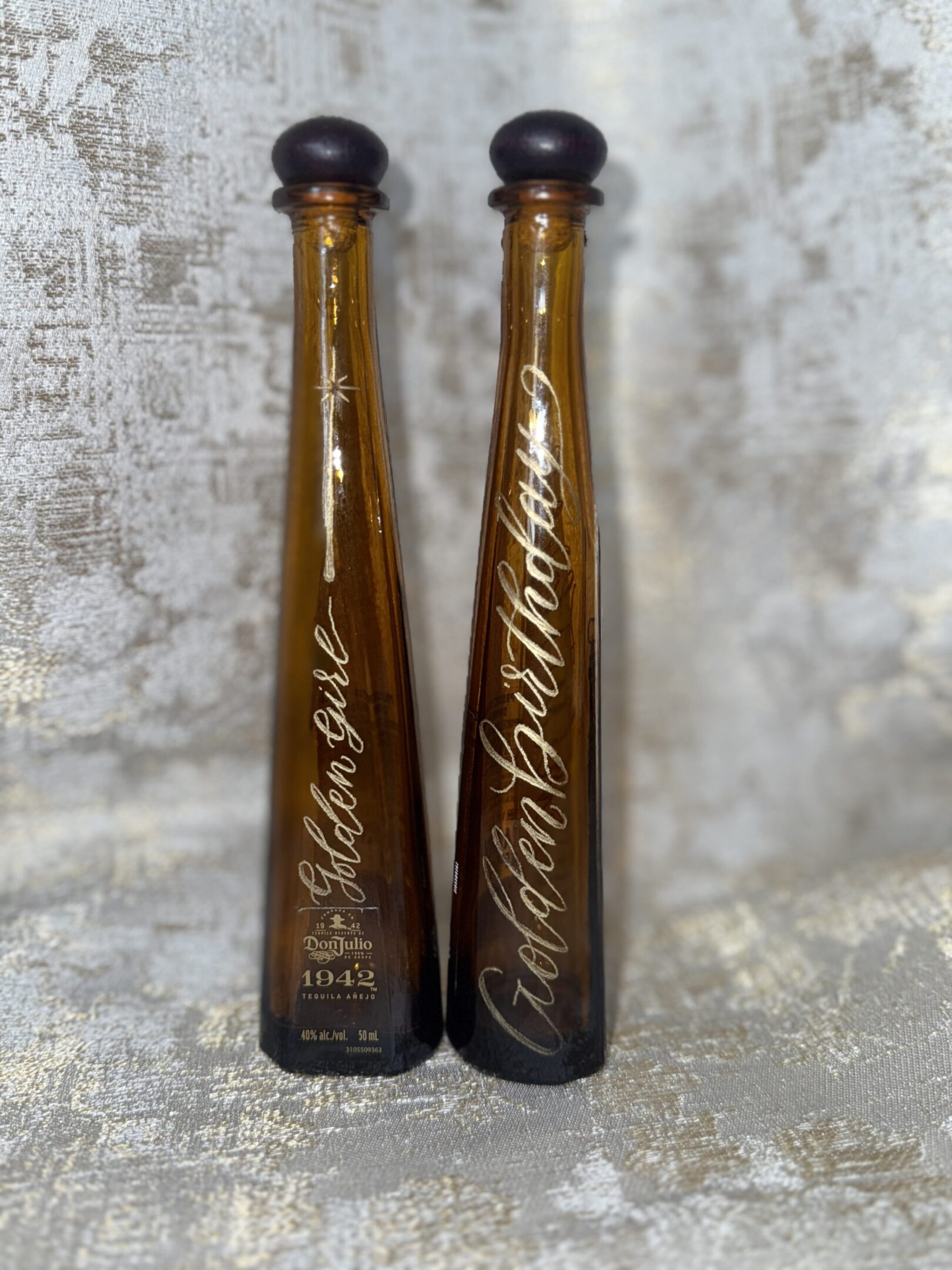 Tall amber bottles with black caps