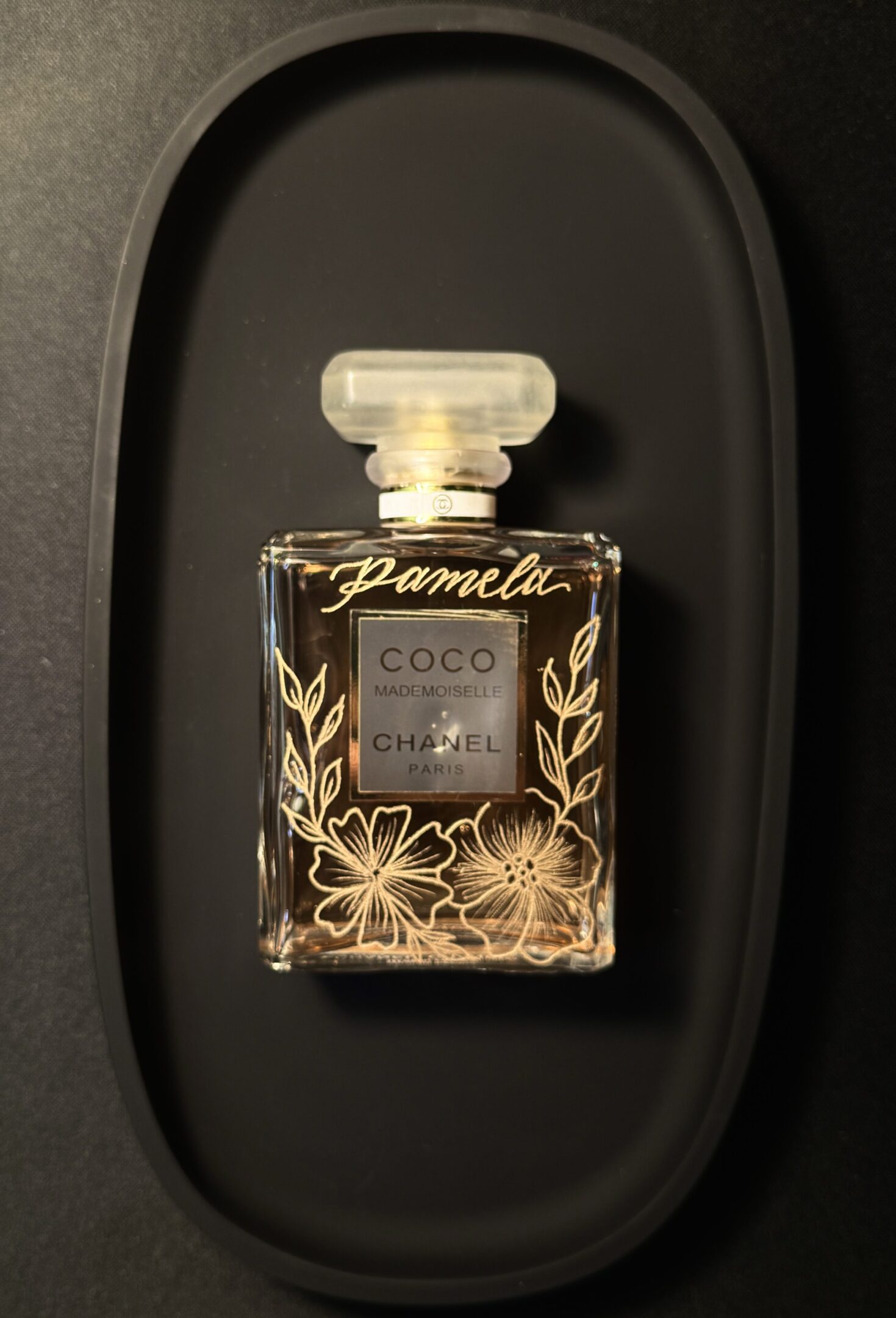 Chanel perfume bottle with floral design