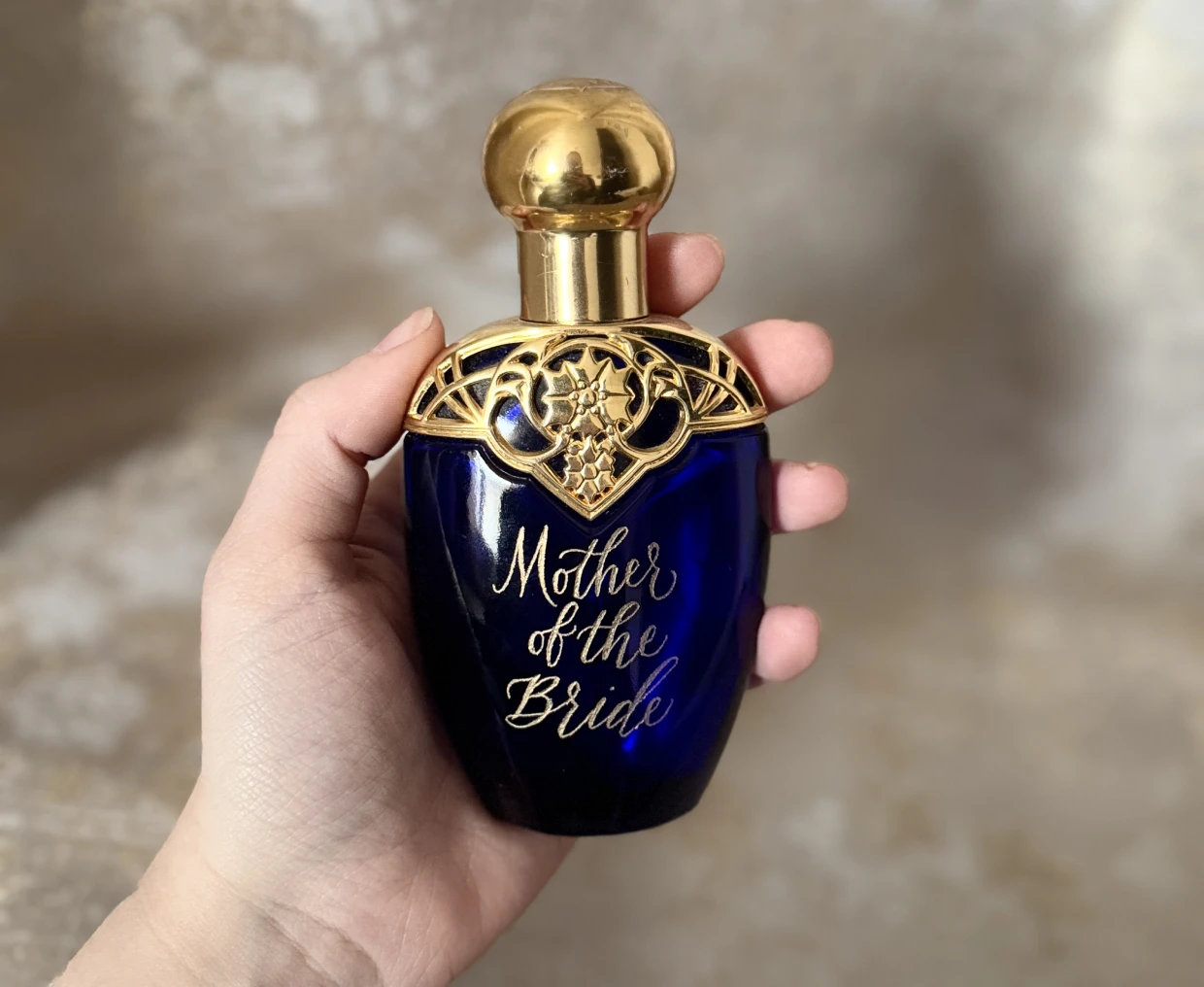 Blue perfume bottle with gold cap
