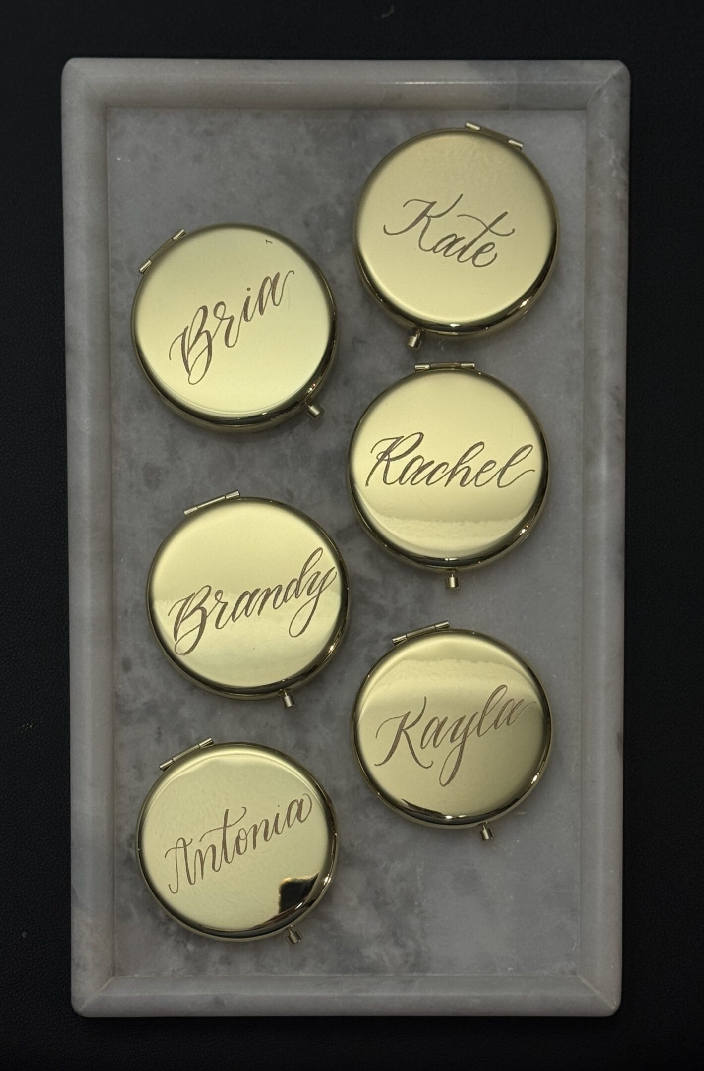 Handwritten name tags arranged on a board.