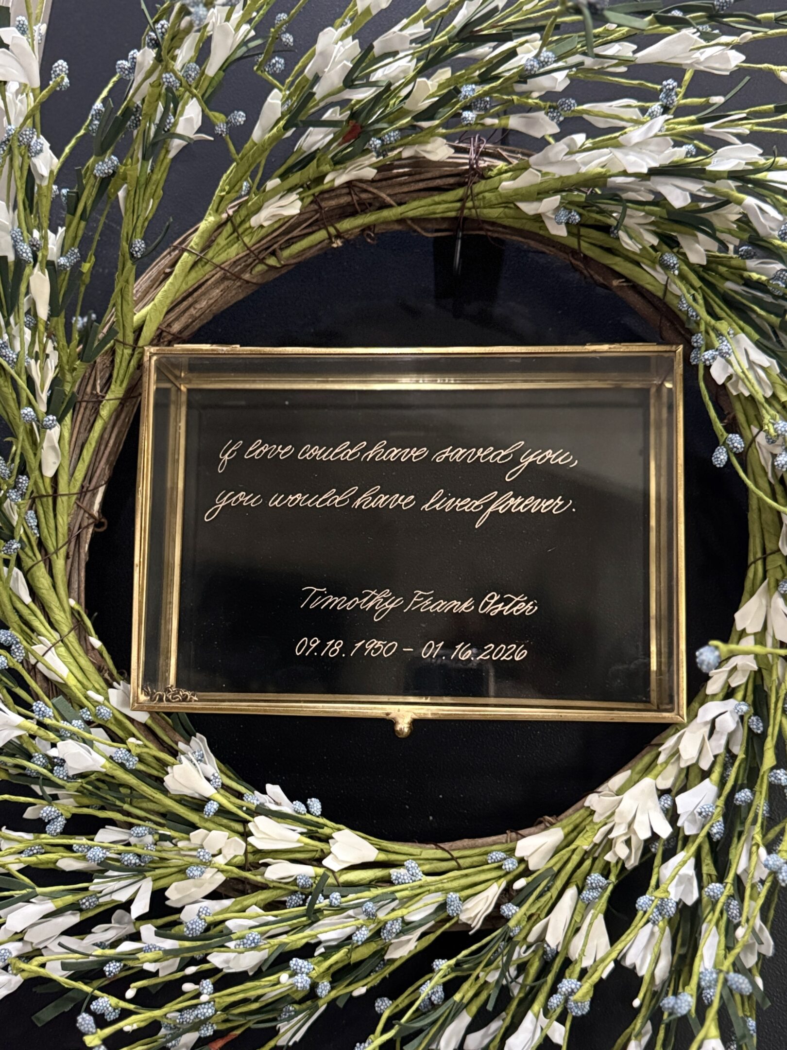 A decorative glass box with a romantic quote inside.